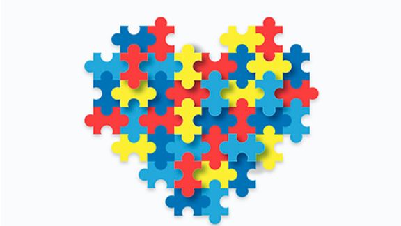 Ilustración de un corazón hecho de piezas de puzzle.